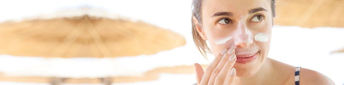 woman using solar cream
