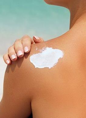 person using solar cream